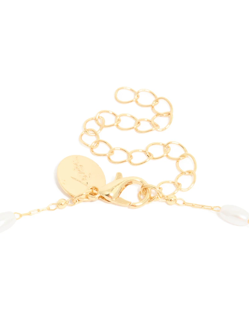 Collier croix cubique en zircone et perles plaqués or