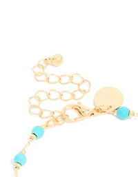 Bracelet en pierres semi-précieuses turquoise plaquées or