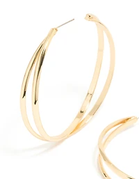 Grandes boucles d’oreilles en croix dorées