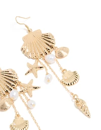 Boucles d’oreilles tombantes en perles d’or et multi-coquillages
