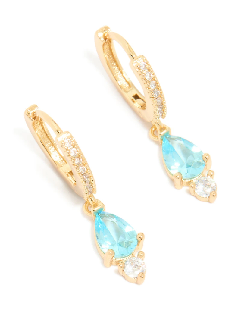 Boucles d’oreilles Huggie en zircone cubique bleu plaquées or