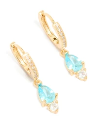 Boucles d’oreilles Huggie en zircone cubique bleu plaquées or