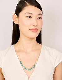 Collier de pendentifs circulaires cubiques en zirconie plaqués or et bleu foncé
