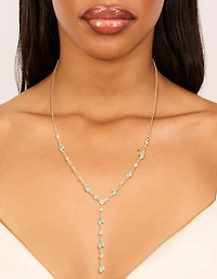 Collier en Y ovale alterné en zircone bleu bleu plaqué or