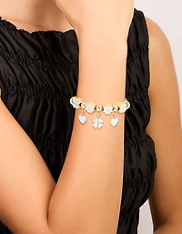 Bracelet à bascule en forme de trèfle bleu doré et en forme de cœur