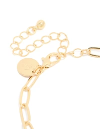 Bracelet à breloques croix et cœur plaqués or
