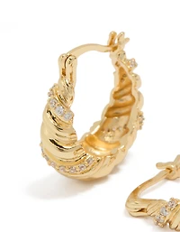 Boucles d'oreilles créoles torsadées plaquées or et serties de zirconiums cubiques