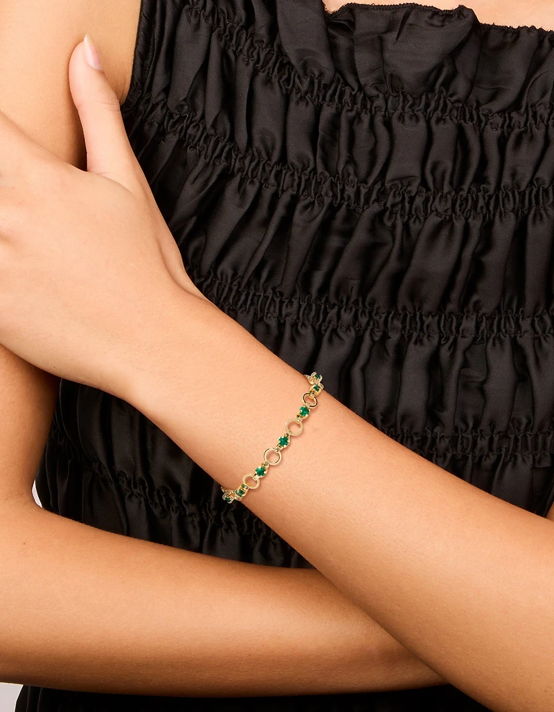 Bracelet plaqué or à maillons alternés ronds en zircone cubique verte