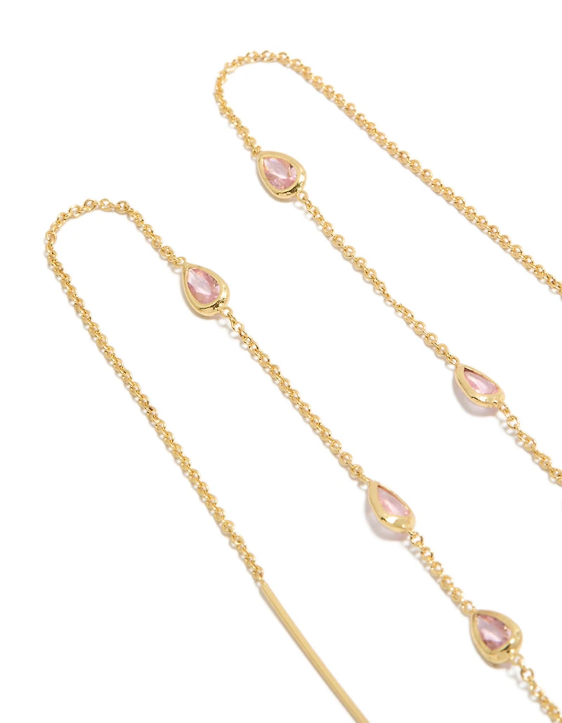 Boucles d'oreilles pendantes en forme de poire, plaquées or, ornées de strass roses.
