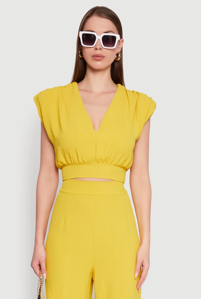 Chic Crepe Knit Blouse with Padded Shoulders and Tie Back