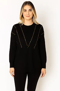 Knitted sweater with studded appliqués