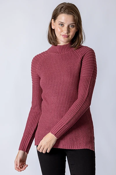 Le chandail long en tricot rose