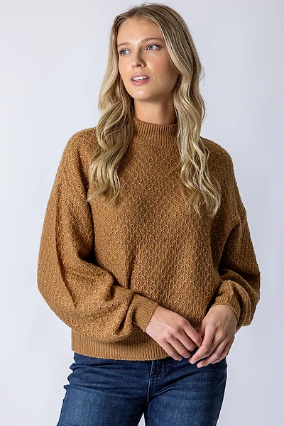 Le tricot nid d’abeille et manches ballons