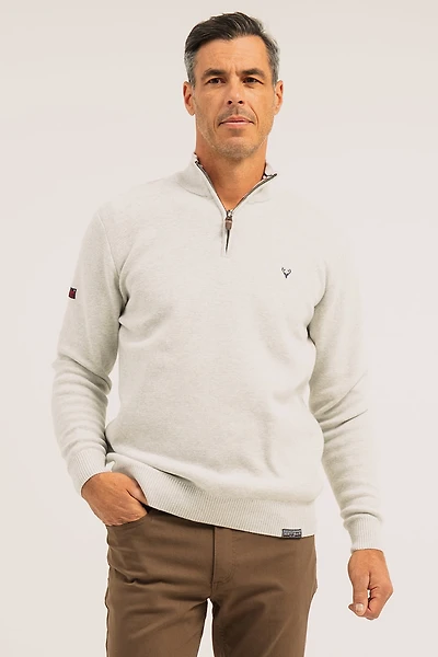 Le chandail en tricot de coton col montant avec fermeture éclair