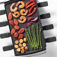 Ensemble à raclette réversible