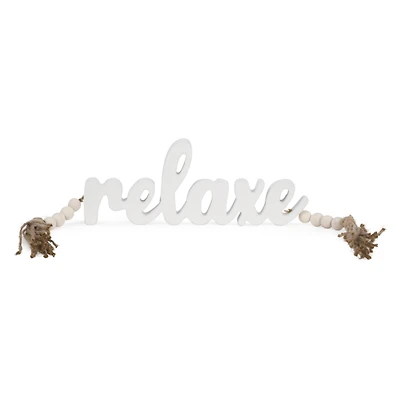 Mot "Relaxe" blanc avec billes