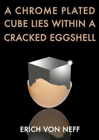 A Chrome Plated Cube Lies Within a Cracked Eggshell