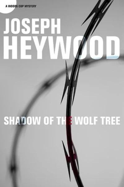 Shadow of the Wolf Tree: A Woods Cop Mystery
