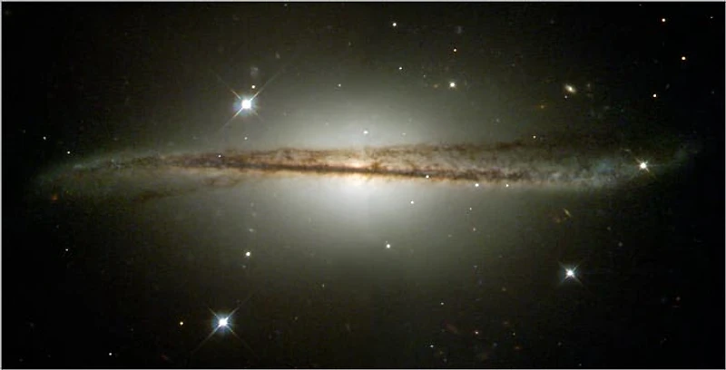 Hubble Photographs Warped Galaxy as Camera Passes Milestone