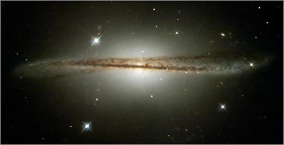 Hubble Photographs Warped Galaxy as Camera Passes Milestone