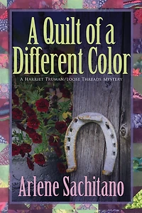 a Quilt of Different Color (Harriet Truman/Loose Threads Mystery, #13)