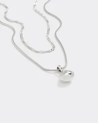 Collier double avec pendentif en métal