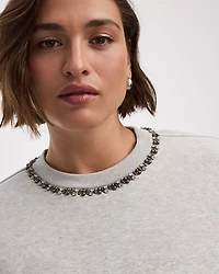 Pull en molleton à manches longues et col rond avec strass