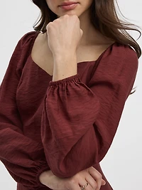 Robe bustier à manches longues bouffantes et encolure en coeur