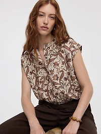 Blouse boutonnée à manches très courtes et col rond