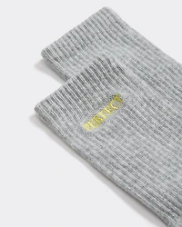 Bas côtelés avec mot à l'ourlet