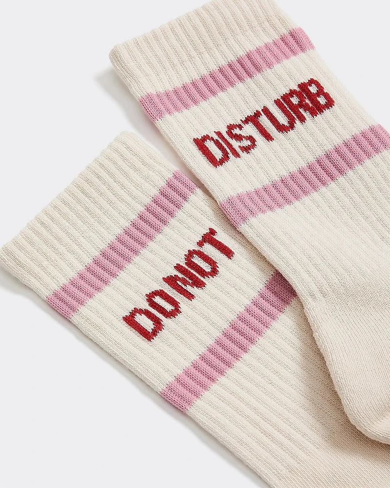 Bas côtelés avec citation à l'ourlet