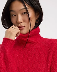 Pull à manches longues bouffantes et col montant