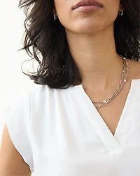 Blouse à manches très courtes et col fendu