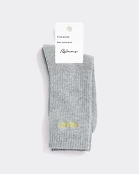 Bas côtelés avec mot à l'ourlet