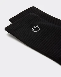 Bas côtelés avec bonhomme sourire à l'ourlet