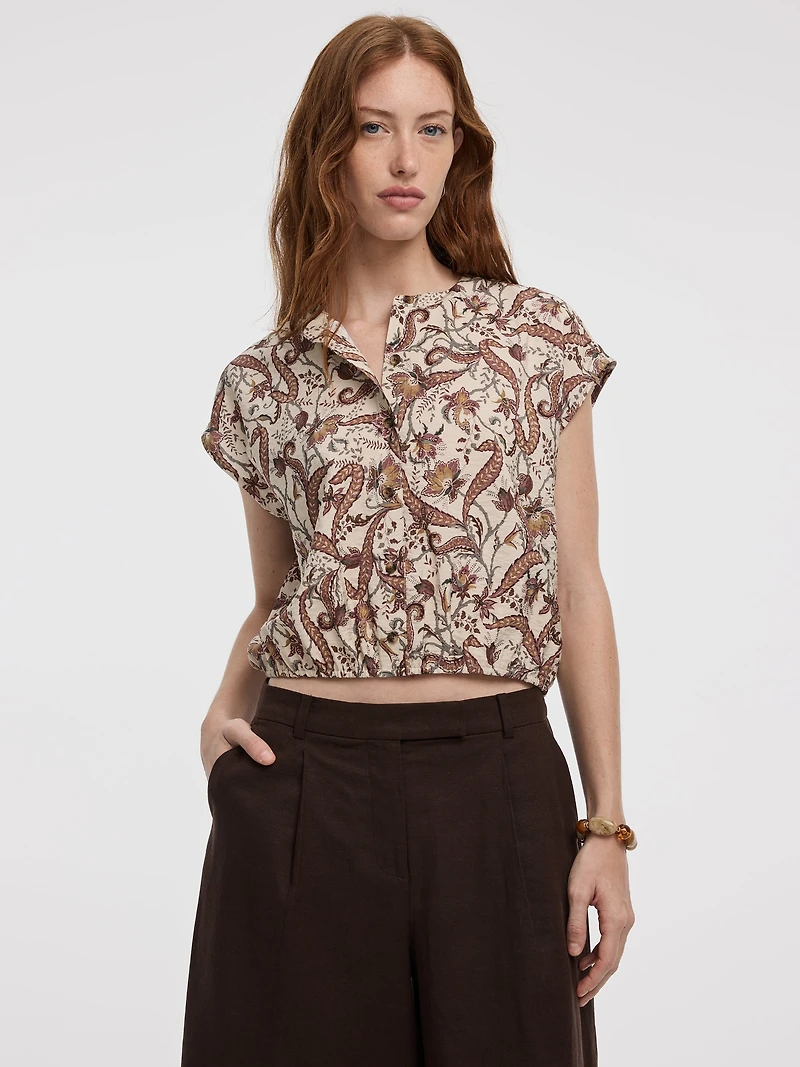 Blouse boutonnée à manches très courtes et col rond