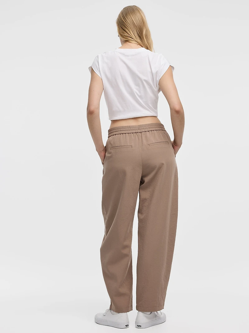 Pantalon à jambe ballon plis nervurés