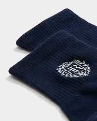 Bas cheville côtelés avec emblème brodé