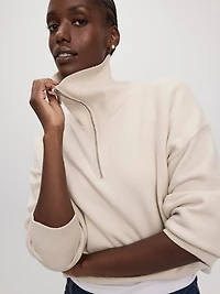 Pull à manches longues et col montant demi-zip