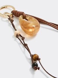 Breloque pour sac en corde avec pièce en résine