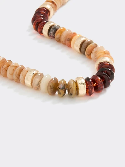 Collier court avec billes en forme de disque