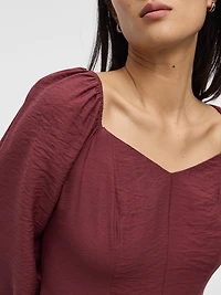 Robe bustier à manches longues bouffantes et encolure en coeur