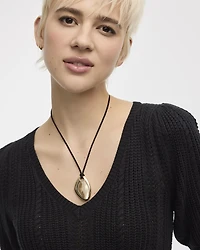 Pull à manches aux coudes bouffantes et col V