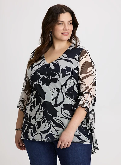Haut tunique transparent à motif floral