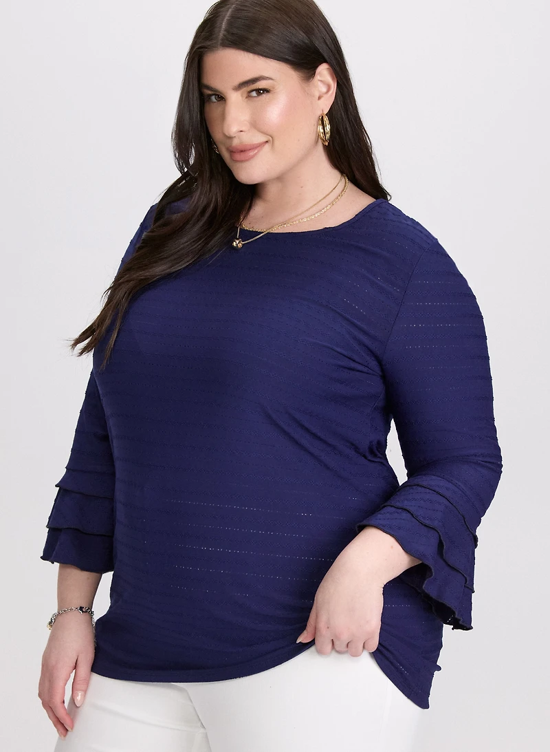 Haut à broderies lignées