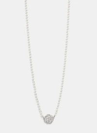 Collier en perles à pendentif floral