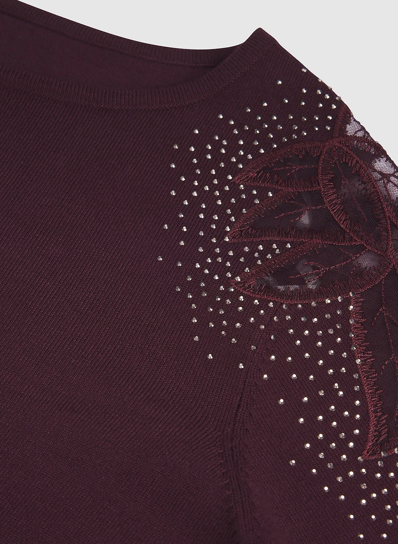 Pull à manches transparentes pierres