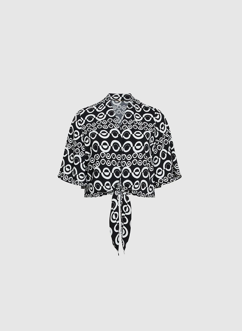Blouse nouée à motif géométrique
