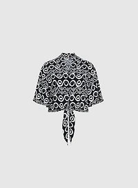 Blouse nouée à motif géométrique