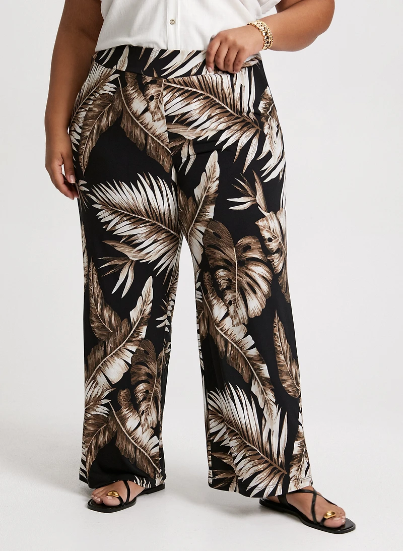 Pantalon jambe large à motif palmiers
